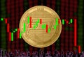 Gold Coin Cryptocurrency Give A Round on a background of blurry numbers and a candlestick chart. Silhouettes of office workers