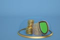 Gold coin stacks in glass bell with gold base on blue background Royalty Free Stock Photo