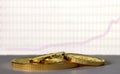 Gold coins on the background of the growth chart. Royalty Free Stock Photo