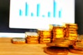 Gold coins, gold bars, sorting, concept, saving, education, gold investment Forex trading, stock table background blur