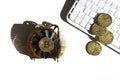 Gold coins with bitcoin symbol. White computer keyboard and radiator. Royalty Free Stock Photo