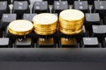 Gold coins and black keyboard. Work at home. Make maoney.Select focus. Freelance concept Royalty Free Stock Photo