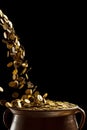 Gold coins falling in the vintage pot Royalty Free Stock Photo