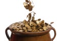 Gold coins falling in the vintage pot Royalty Free Stock Photo