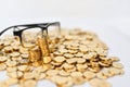 Gold coins and glassess