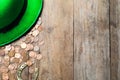 Gold coins, horseshoe and green leprechaun hat on table, flat lay with space for text. St. Patrick`s Day celebration Royalty Free Stock Photo