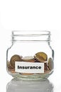Gold coins in jar with Insurance Royalty Free Stock Photo