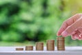 Gold coins stack on wooden table in the morning sunlight. business, investment, retirement, finance and Money Saving for the futur Royalty Free Stock Photo