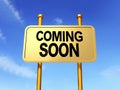 A gold color sign board that says coming soon on it