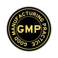 Gold color of word GMP on black round sticker on white background