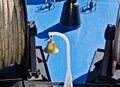Gold colored bell on ship deck Royalty Free Stock Photo