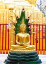 Gold-colored Buddha statue in Buddhist temple Royalty Free Stock Photo