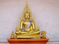 Gold-colored Buddha statue in Buddhist temple Royalty Free Stock Photo