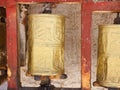 Gold colored Buddhist prayer wheel in Lhasa, Tibet Royalty Free Stock Photo