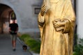 Gold colored bust of Aloysius Stepinac in front of Pauline monastery