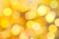 Gold colored Christmas bokeh light abstract holiday background. Royalty Free Stock Photo