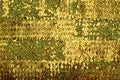 Gold colored confetti and tinsel background Royalty Free Stock Photo