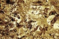 Gold colored crushed foil textured background Royalty Free Stock Photo