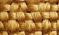 A gold colored fabric with a gold colored thread Royalty Free Stock Photo