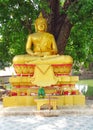 Gold-colored lying Buddha statue in Buddhist temple Royalty Free Stock Photo