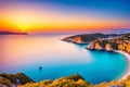 a gold colored sunset on the Adriatic sea coastline.
