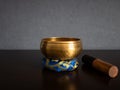 Tibetan singing bowl and striker with copy space Royalty Free Stock Photo