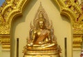 Gold colour Buddha statue in Buddhist temple Royalty Free Stock Photo