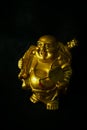 Golden colour happy Buddha statue Royalty Free Stock Photo