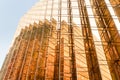 Gold colour office building tower facade in business center Royalty Free Stock Photo