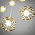 Gold coloured wire frame hanging lamps. Royalty Free Stock Photo