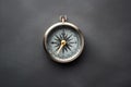 A gold compass on a black background, perfect for navigation themes Royalty Free Stock Photo