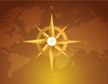 Gold compass over a world map brown