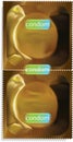 Gold condom packet. Royalty Free Stock Photo