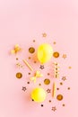Gold confetti, balloons, streamers on a pink background. Colorful celebration, birthday. Christmas or New Year pattern Royalty Free Stock Photo
