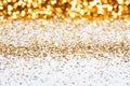 Gold confettis backgrounds with white backgrounds. Royalty Free Stock Photo