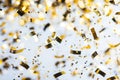 Gold confettis backgrounds on white backgrounds. Royalty Free Stock Photo