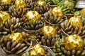 Gold covered coconuts and bananas temple offerings in Yangon, Myanmar (Burma)