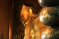 He gold covered reclining buddha at Wat Pho in Bangkok, Thailand Royalty Free Stock Photo