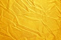 Gold creased fabric silk Royalty Free Stock Photo