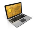 Gold credit card on a laptop screen