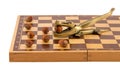 Gold crocodile nut crush tool chess board isolated Royalty Free Stock Photo