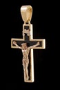 Gold cross pendant with crucifix Royalty Free Stock Photo