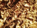 Gold crumpled foil close-up.