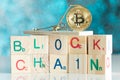 Gold cryptocurrency coin bitcoin in mousetrap on blockchain bloc