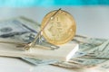 Gold cryptocurrency coin bitcoin in mousetrap on pile of cash. C Royalty Free Stock Photo
