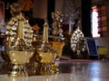 Gold cup for pray of buddhism in Sri Chompoo Ong Tue temple in Nong Khai province of Thailand.