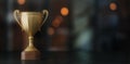 Gold cup winner on dark bokeh background