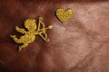 Gold cupid heart leather background