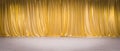gold curtains on light wooden floor Royalty Free Stock Photo