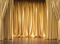 Gold curtains and wooden floor Royalty Free Stock Photo